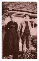 Couple outside Fish St cottages