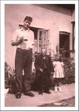 Appleton cottage with tall & small man